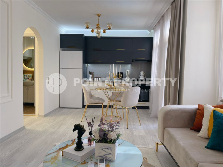 Заезжай и живи. Двухкомнатная квартира 1+1 в самом центре курортного города в 750 метрах от моря. Апартаменты находятся в районе Сарай Алании, который подходит для оформления ВНЖ.-id-1128-фото-5