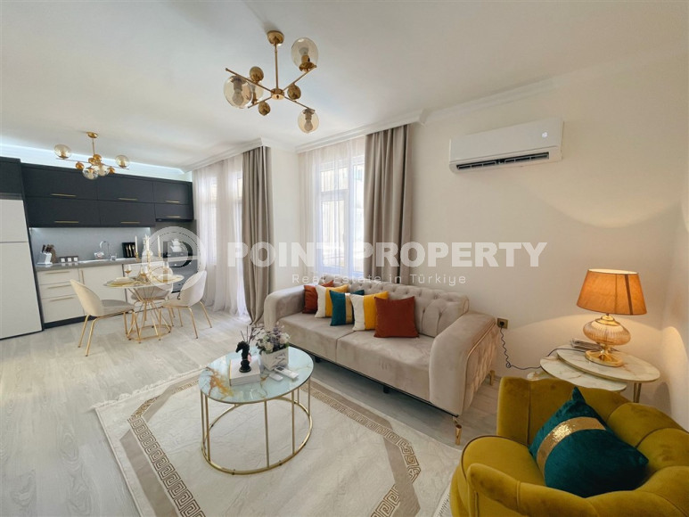 Заезжай и живи. Двухкомнатная квартира 1+1 в самом центре курортного города в 750 метрах от моря. Апартаменты находятся в районе Сарай Алании, который подходит для оформления ВНЖ.-id-1128-фото-9