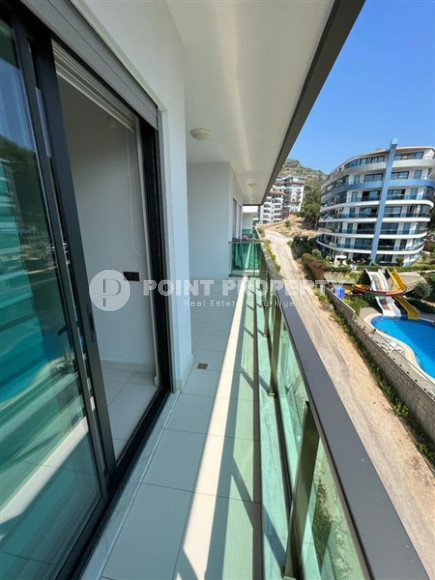 Меблированная квартира 1+1, 65м², в элитном комплексе с собственным пляжем в Каргыджаке, Алания-id-1895-фото-12