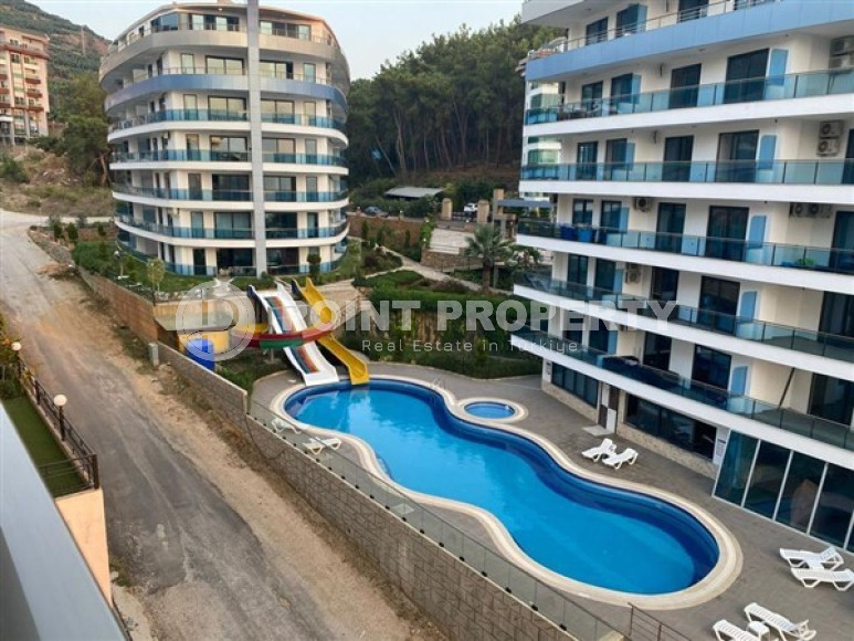 Меблированная квартира 1+1, 65м², в элитном комплексе с собственным пляжем в Каргыджаке, Алания-id-1895-фото-19