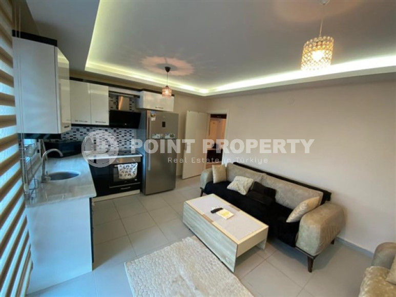 Уютная двухкомнатная квартира, 65м², в резиденции с бассейном в районе Махмутлар, Алания-id-1933-фото-7