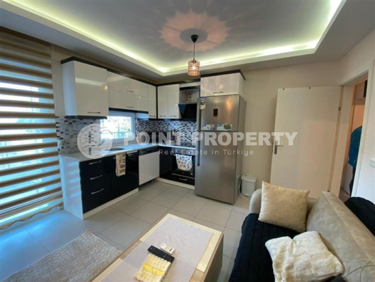 Уютная двухкомнатная квартира, 65м², в резиденции с бассейном в районе Махмутлар, Алания-id-1933-фото-8