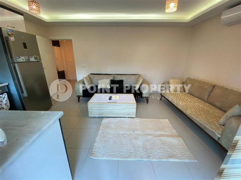 Уютная двухкомнатная квартира, 65м², в резиденции с бассейном в районе Махмутлар, Алания-id-1933-фото-9