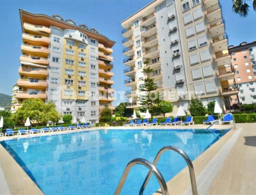 Three-room apartment, 110m², in a cozy complex with a swimming pool in the center of Alanya-id-1960-photo-1
