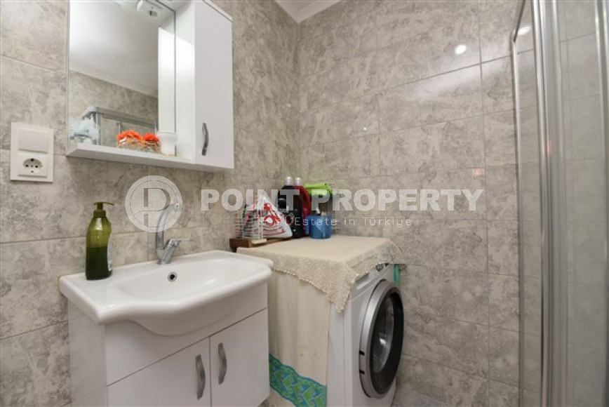 Linear four-room apartment, 150m², with separate kitchen, 1500m from the sea in Oba, Alanya-id-1984-photo-19