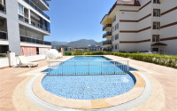 Linear four-room apartment, 150m², with separate kitchen, 1500m from the sea in Oba, Alanya-id-1984-photo-29