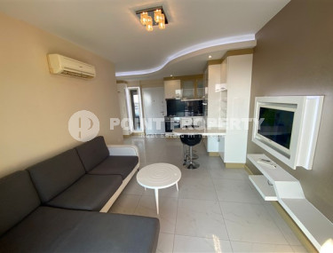One bedroom apartment, 50m², with furniture and household appliances in an elite residence in the center of Alanya-id-2011-photo-2