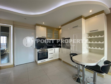 One bedroom apartment, 50m², with furniture and household appliances in an elite residence in the center of Alanya-id-2011-photo-4