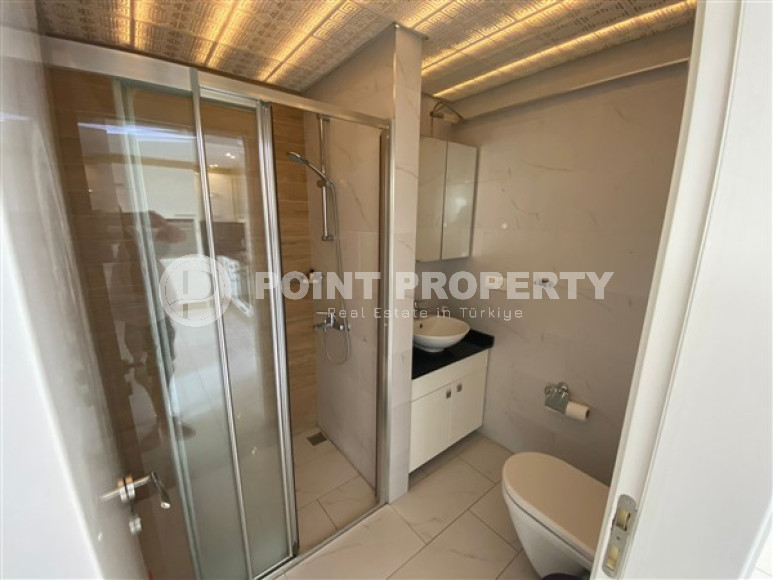 One bedroom apartment, 50m², with furniture and household appliances in an elite residence in the center of Alanya-id-2011-photo-6