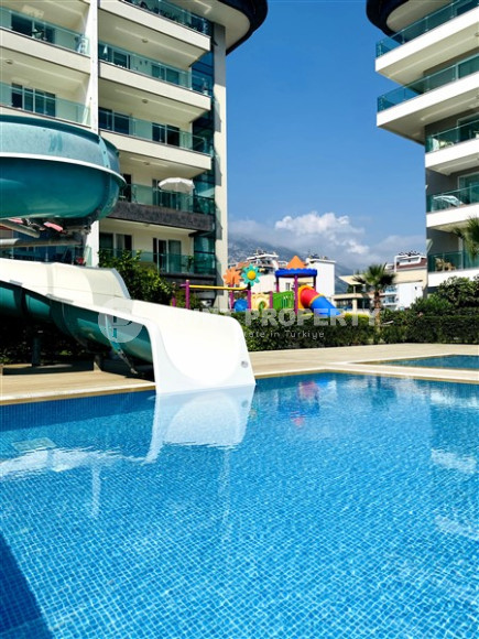 Просторная двухкомнатная квартира, 60м², в уютном комплексе в Кестеле, Алания, в 50м от моря-id-2014-фото-14