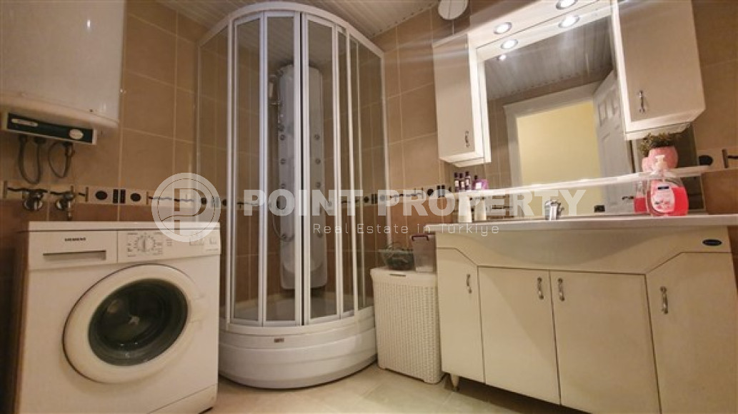 Квартира с двумя спальнями, 110м², с видом на море и горы на центральной улице в районе Алании Тосмур-id-2019-фото-12