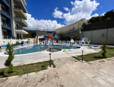 Apartment 1+1, 56m2 in the popular area of Mahmutlar. 750 meters to the sea.-id-2081-photo-4