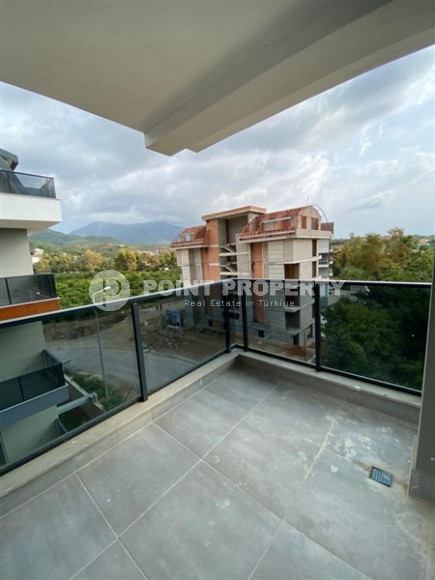 Apartment in a new building with beautiful mountain views in the Oba area-id-2092-photo-31