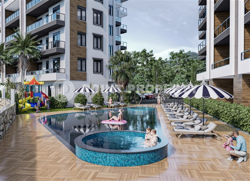 Apartments of different layouts, 62-135m², in a complex under construction, 550m from the sea in the Tosmur area, Alanya-id-2096-photo-7