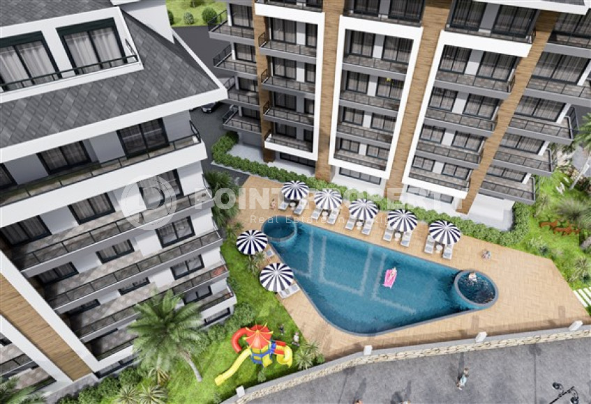 Apartments of different layouts, 62-135m², in a complex under construction, 550m from the sea in the Tosmur area, Alanya-id-2096-photo-9