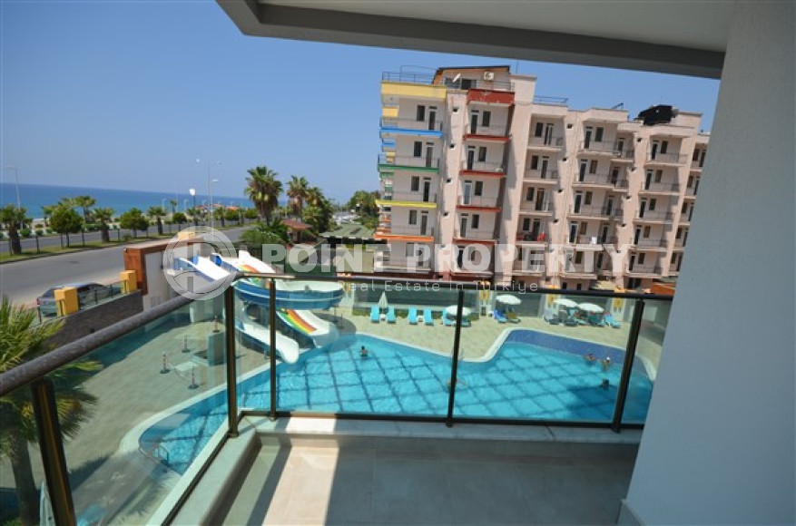 Просторные двухкомнатные апартаменты площадью 80 м2, на первой береговой линии в районе Махмутлар-id-2144-фото-17