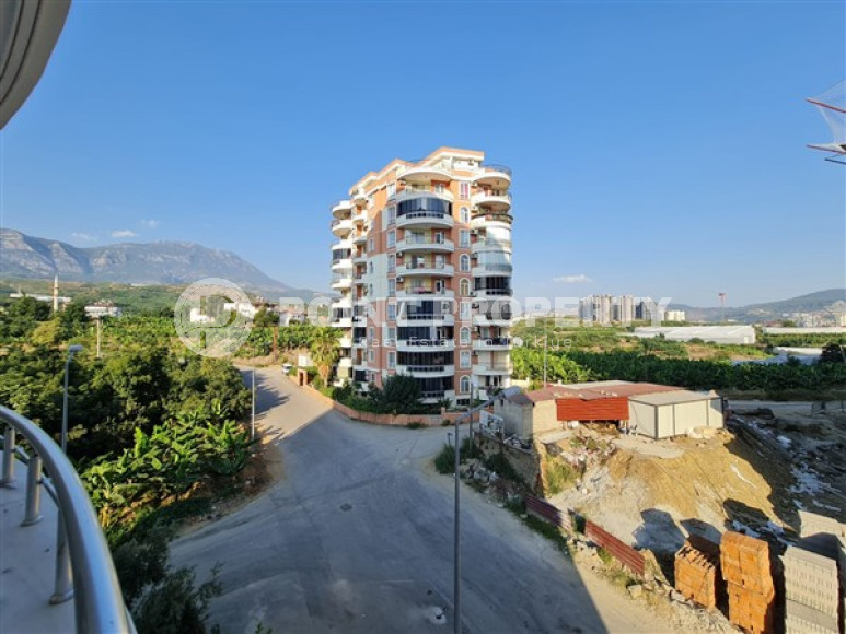 Просторная квартира с одной спальней, 65м², с видом на горы в 750м от моря в Махмутларе, Алания-id-2165-фото-17
