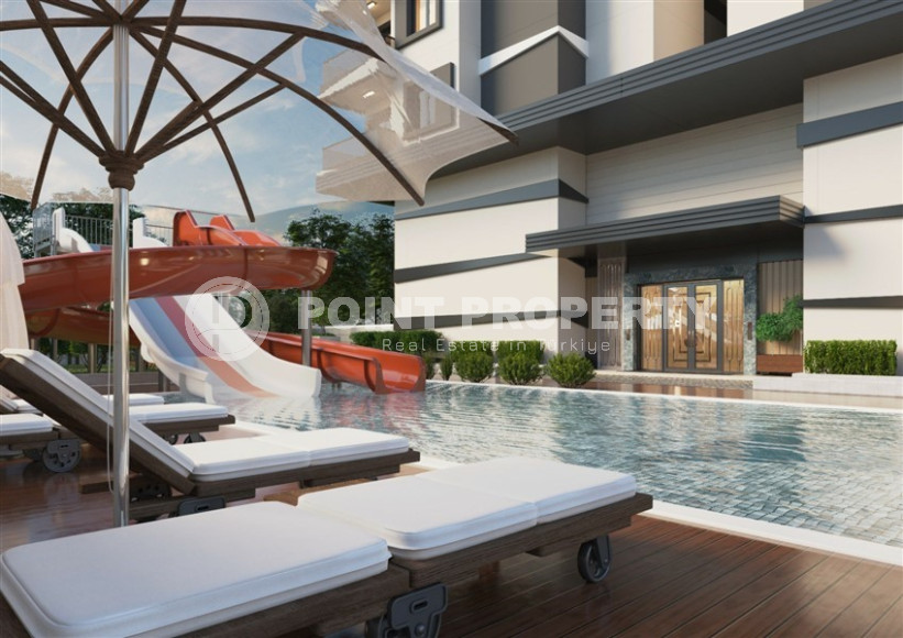 Apartment 2+1 in a premium class complex under construction in Mahmutlar, 100m from the sea at an attractive price-id-1180-photo-3