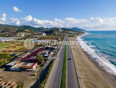 Апартаменты с одной спальней 65 кв. м  в 200 метрах от моря в новом комплексе уединенного района Демирташ, Алания.-id-2252-фото-1