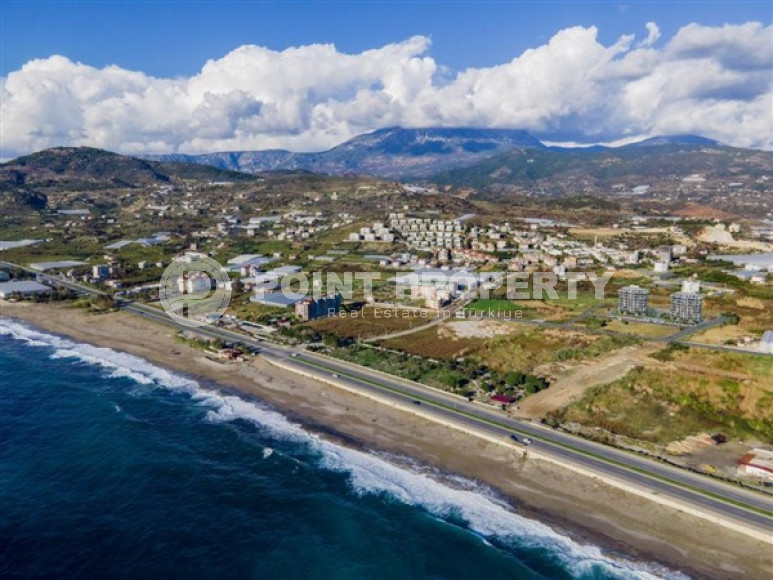 Апартаменты с одной спальней 65 кв. м  в 200 метрах от моря в новом комплексе уединенного района Демирташ, Алания.-id-2252-фото-2