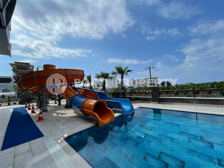 Новая квартира с двумя спальнями, 105м² с видом на море в новом комплексе в Каргыджаке, Алания-id-2260-фото-16