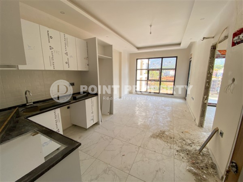 Apartment with an area of 60 m² in a new premium residence in Oba, Alanya.-id-2268-photo-3