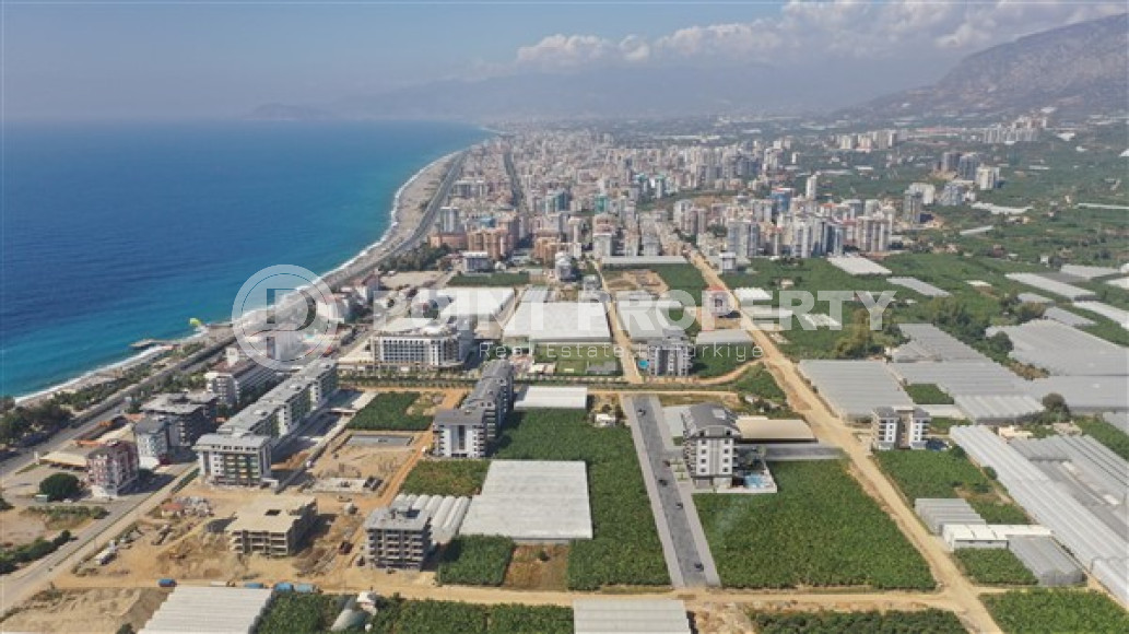 Апартаменты в комплексе премиум класса на этапе строительства в 400м от моря в районе Каргыджак-id-2330-фото-14