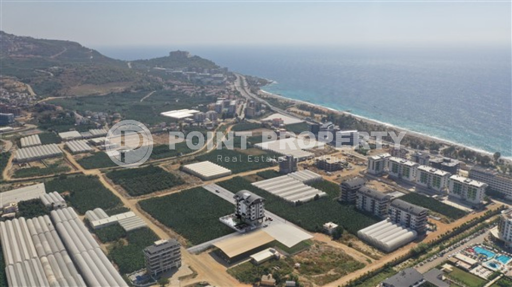 Апартаменты в комплексе премиум класса на этапе строительства в 400м от моря в районе Каргыджак-id-2330-фото-15