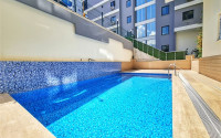 Apartment 1+1 in an elite residence with an area of 67 m², 350 m from the sea in Mahmutlar, Alanya-id-2335-photo-13