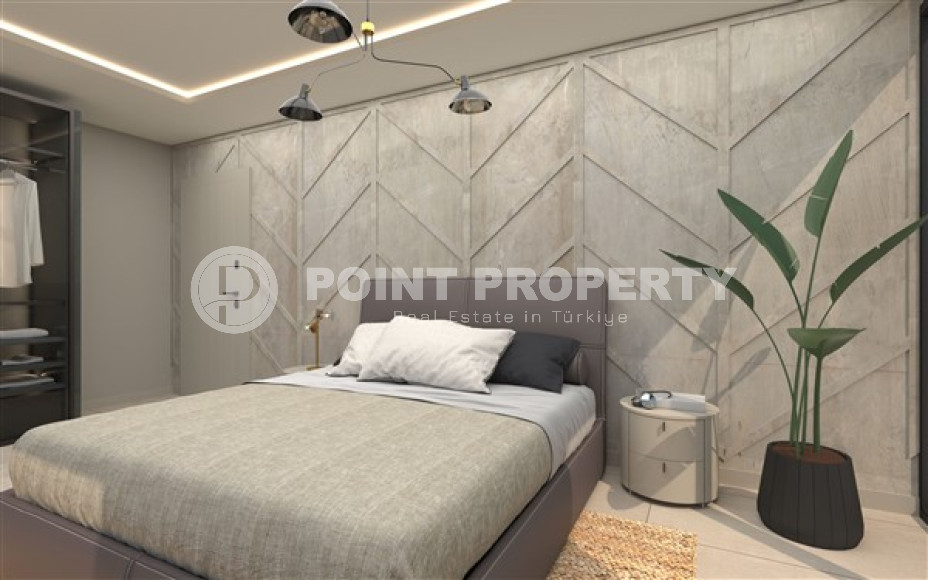 Новая двухкомнатная квартира, 55м², в комплексе на этапе строительства в 800м от моря, Аланья, Каргыджак-id-2358-фото-7