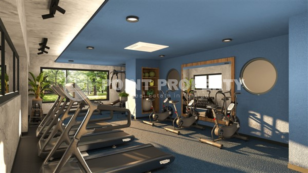 Новая двухкомнатная квартира, 55м², в комплексе на этапе строительства в 800м от моря, Аланья, Каргыджак-id-2358-фото-17