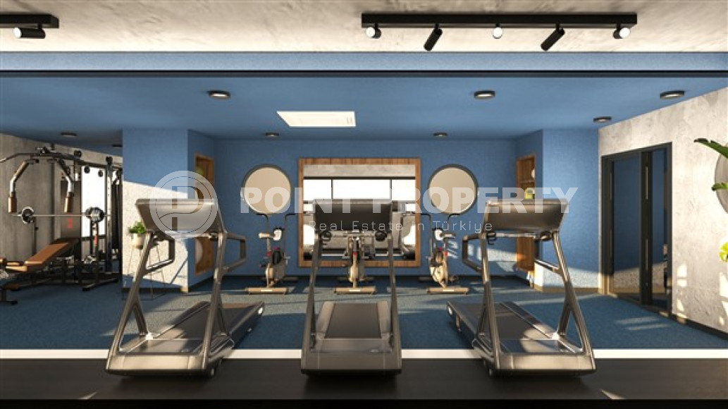 Новая двухкомнатная квартира, 55м², в комплексе на этапе строительства в 800м от моря, Аланья, Каргыджак-id-2358-фото-18