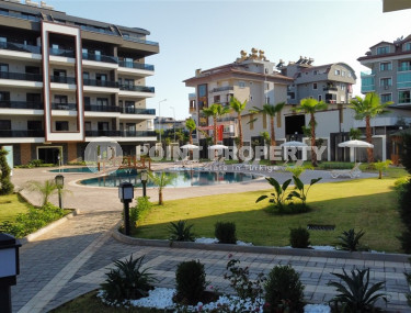 Cozy two-room apartment 1+1 with an area of 52 m2 in a modern residential complex with a private pool in Oba, Alanya-id-1202-photo-2