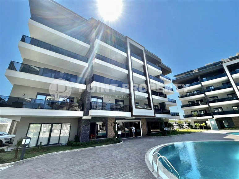 Cozy two-room apartment 1+1 with an area of 52 m2 in a modern residential complex with a private pool in Oba, Alanya-id-1202-photo-3