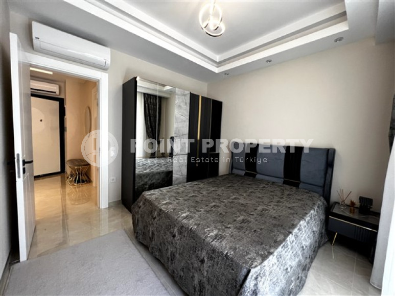 Меблированная двухкомнатная квартира, 65м², в новом элитном комплексе в Махмутларе, 650м до моря-id-2381-фото-11