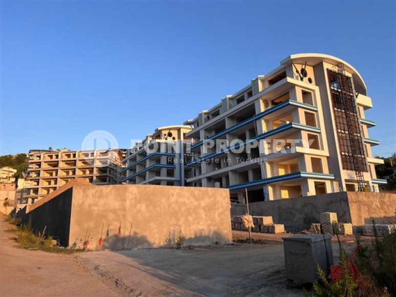 Квартира с одной спальней, 65м², в комплексе на этапе строительства в 800м от моря, Аланья, Каргыджак-id-2388-фото-17