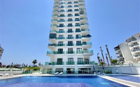 Furnished three-room apartment, 85m², on the first coastline in Mahmutlar, Alanya-id-2412-photo-1