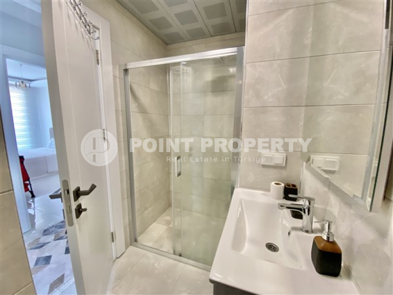 Furnished three-room apartment, 85m², on the first coastline in Mahmutlar, Alanya-id-2412-photo-14