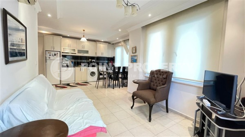 Просторная квартира с одной спальней, 60м², в центре Алании в комплексе с бассейном-id-2415-фото-2