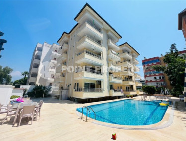 Furnished apartment 1+1, 70m², in a complex with a swimming pool 100m from the sea in Oba, Alanya.-id-2417-photo-1