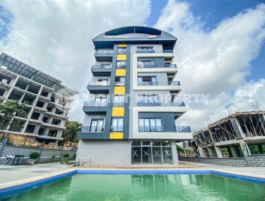 New four-room apartment, 135m², in a complex with a swimming pool in the mountains of Alanya, 3000m from the sea.-id-2432-photo-1