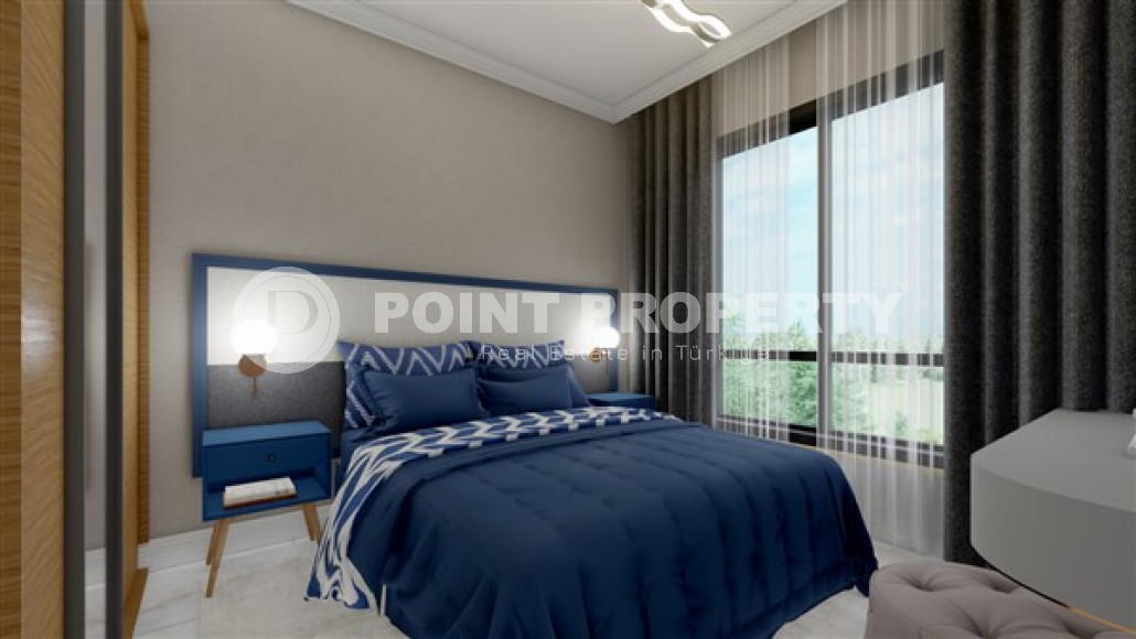 Новая квартира с одной спальней, 50м². в комплексе на этапе строительства в районе Махмутлар, Алания-id-2449-фото-6