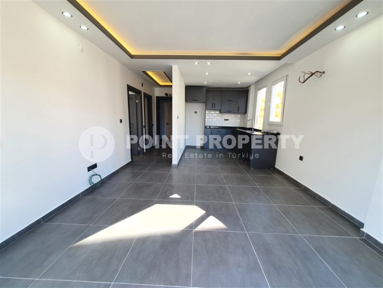 Two-room apartment with 1+1 layout, 60 m2 in one of the popular areas of Mahmutlar. Only 250 m to the sea. An excellent option for moving.-id-1213-photo-3