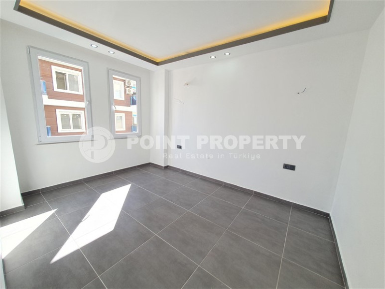Two-room apartment with 1+1 layout, 60 m2 in one of the popular areas of Mahmutlar. Only 250 m to the sea. An excellent option for moving.-id-1213-photo-6