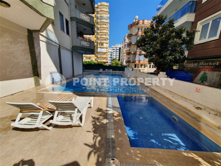 Two-room apartment with 1+1 layout, 60 m2 in one of the popular areas of Mahmutlar. Only 250 m to the sea. An excellent option for moving.-id-1213-photo-11