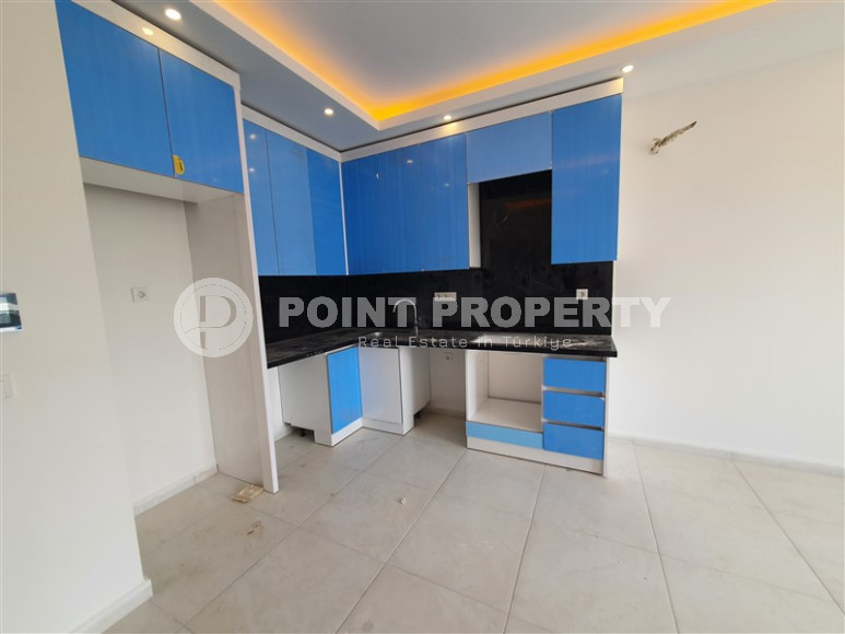 Two-room apartment with mountain views in a new complex in Mahmutlar-id-1211-photo-9