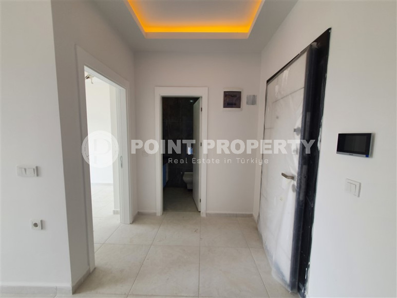 Two-room apartment with mountain views in a new complex in Mahmutlar-id-1211-photo-11