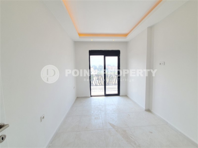 Two-room apartment with mountain views in a new complex in Mahmutlar-id-1211-photo-12