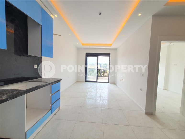 Two-room apartment with mountain views in a new complex in Mahmutlar-id-1211-photo-13