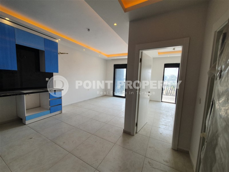 Two-room apartment with mountain views in a new complex in Mahmutlar-id-1211-photo-14